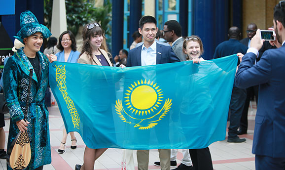 Scholars with flag of Kazakhstan Scholars with flag of Kazakhstan
